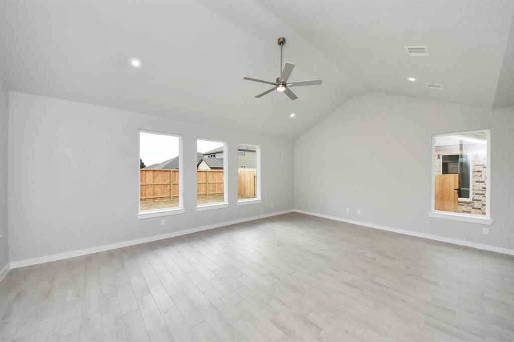 Embrace the warmth and comfort of this inviting family room! Sample photo of completed home with similar floor plan. Actual colors and selections may vary.