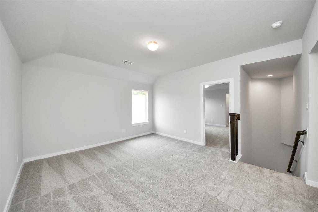 Come upstairs and relish a day of relaxation in this loft area! Ideal as anadditional living space or game room, it boasts plush carpeting, high ceilings,custom paint, and windows that flood the area with abundant natural light. Sample photo of completed home with similar floor plan. Actual colors and selections may vary.