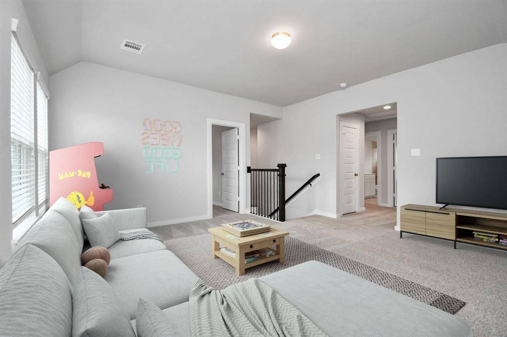 *Virtually Staged* Ascend to relaxation in this fantastic game room! Ideal for both casual gatherings and adultgaming, it boasts plush carpet, lofty ceilings, custom paint, and ample windows for abundantnatural light. Sample photo of completed home with similar floor plan. Actual colors and selections may vary.