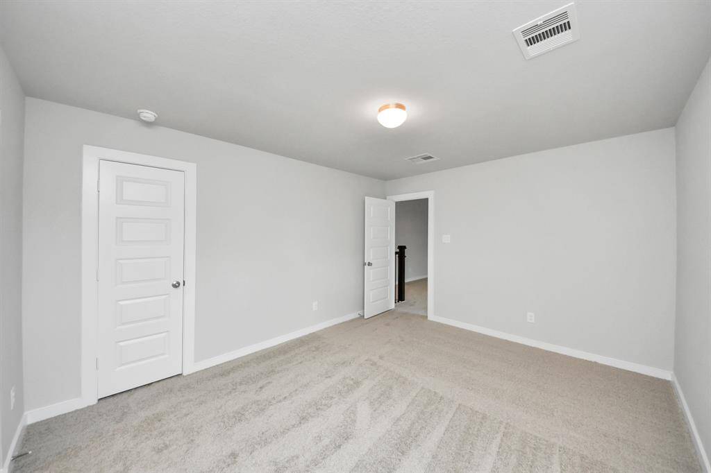 Generously sized secondary bedrooms featuring spacious closets, soft and inviting carpetingunderfoot, large windows allowing plenty of natural light, and the added touch of privacyblinds for your personal retreat. Sample photo of completed home with similar floor plan. Actual colors and selections may vary.