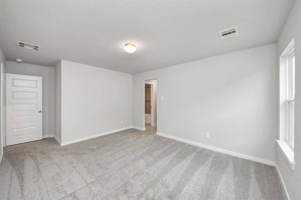 Generously sized secondary bedrooms featuring spacious closets, soft and inviting carpetingunderfoot, large windows allowing plenty of natural light, and the added touch of privacyblinds for your personal retreat. Sample photo of completed home with similar floor plan. Actual colors and selections may vary.