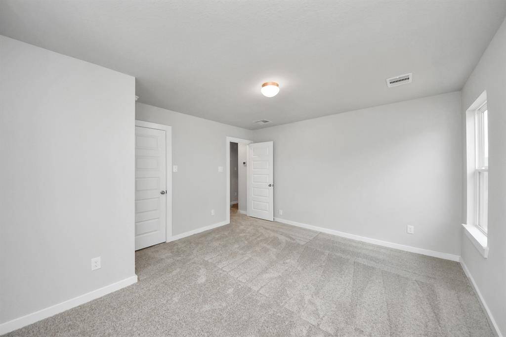 Generously sized secondary bedrooms featuring spacious closets, soft and inviting carpetingunderfoot, large windows allowing plenty of natural light, and the added touch of privacyblinds for your personal retreat. Sample photo of completed home with similar floor plan. Actual colors and selections may vary.