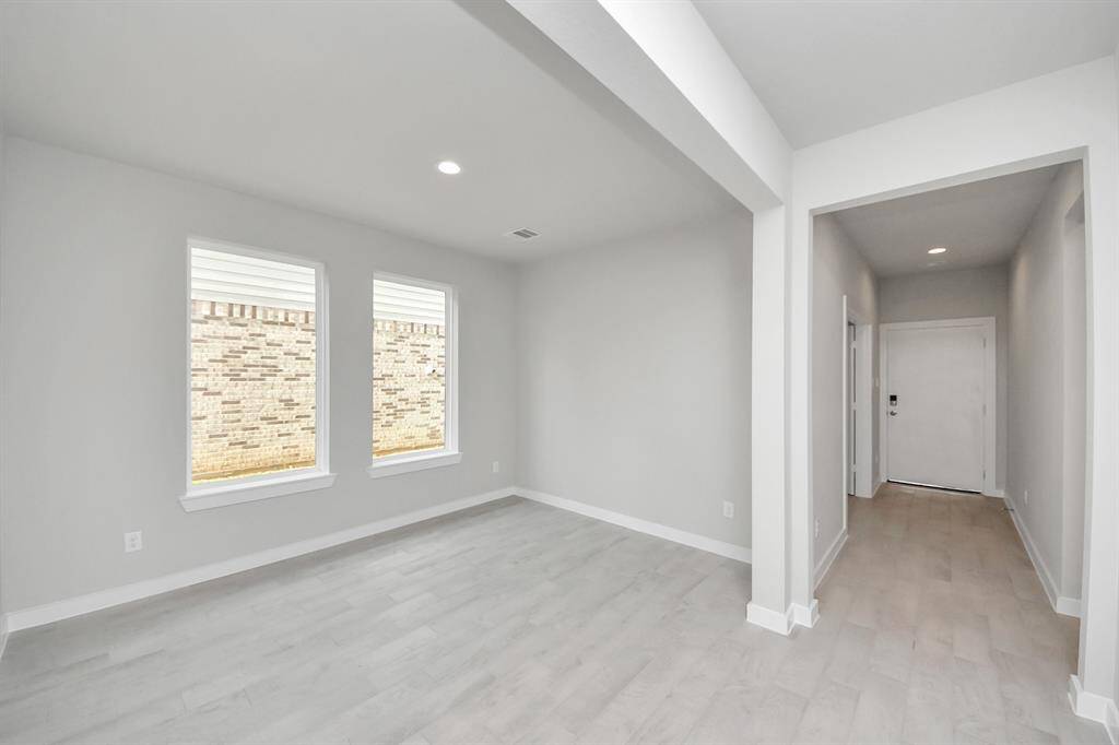 Make memories gathered around the table with your family and friends! This spacious diningroom features elegant flooring, custom paint, and adjacent to family room and kitchen foropen concept feel. Sample photo of completed home with similar floor plan. Actual colors and selections may vary.