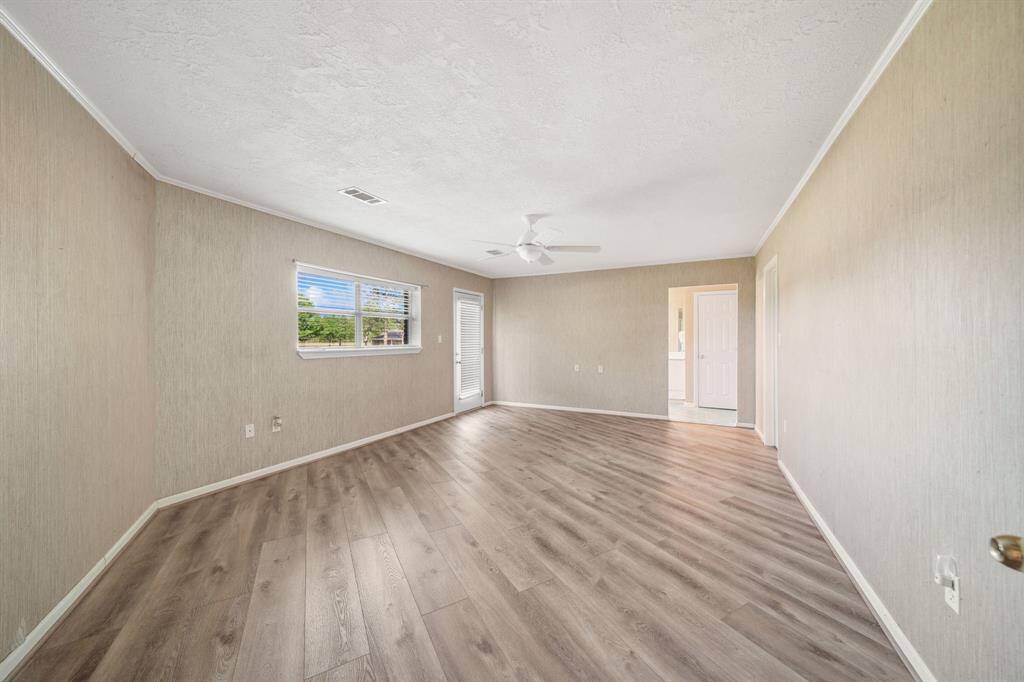 Primary Bedroom, it’s huge!  With an exterior door to your backyard.