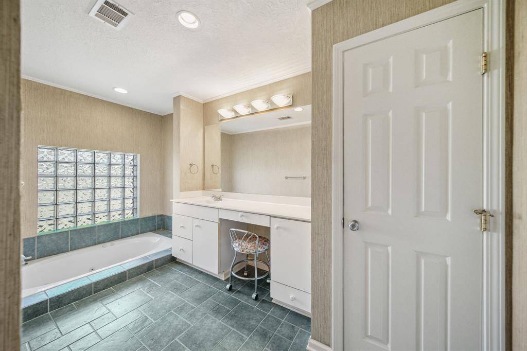 Primary Bath with custom tub and glass block