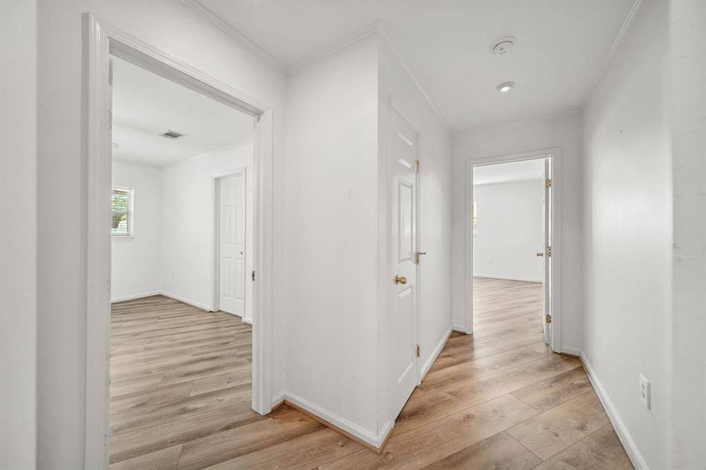 Private hallway to the 2 secondary Bedrooms with the shared Full bath between them