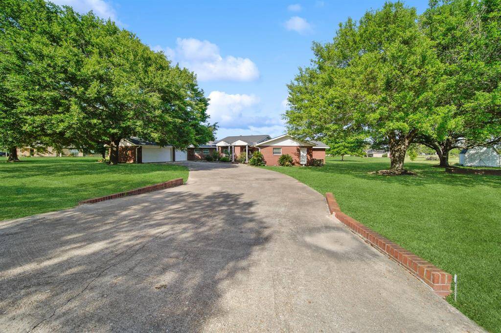 Behind the brick…masonry block walls with metal studs. Exterior walls are 12” thick and insulated. Exterior door houses your second water heater and 2nd A/C , with ample space to work.