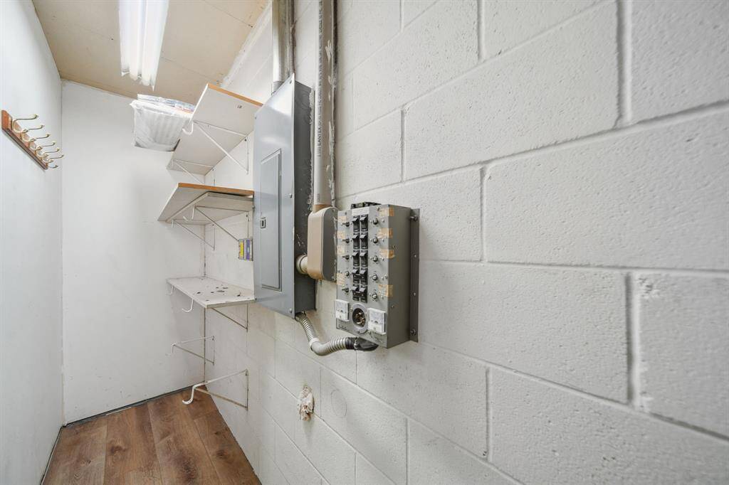 Behind the door in office/flex space, notice the cinder block walls.  All exterior is composed of 12” walls to aid in keeping your utilitiy bills low.  Lots of storage in this home