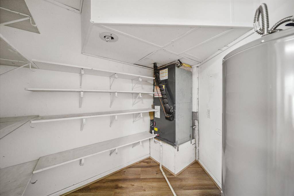This is the other closet in the Office/flex space. It has 1 of your 2 water heaters, 1 of your 2 A/Cs and plenty of storage