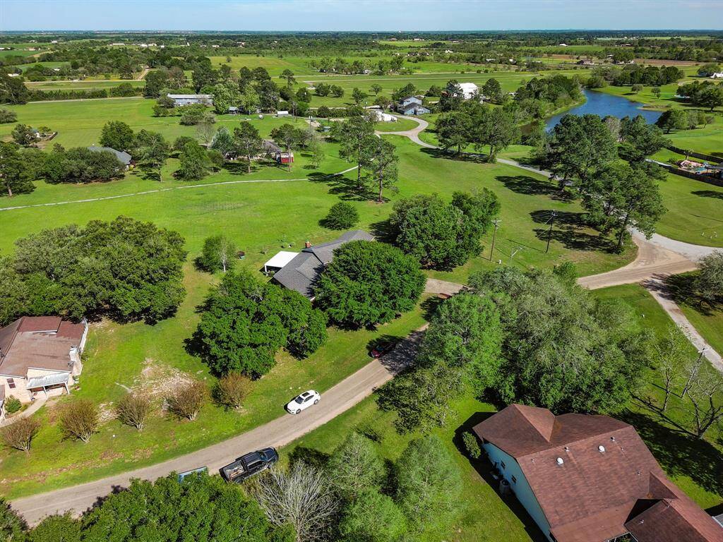 Overview of some of the quiet neighborhood with mature Oaks and privately owned open space.