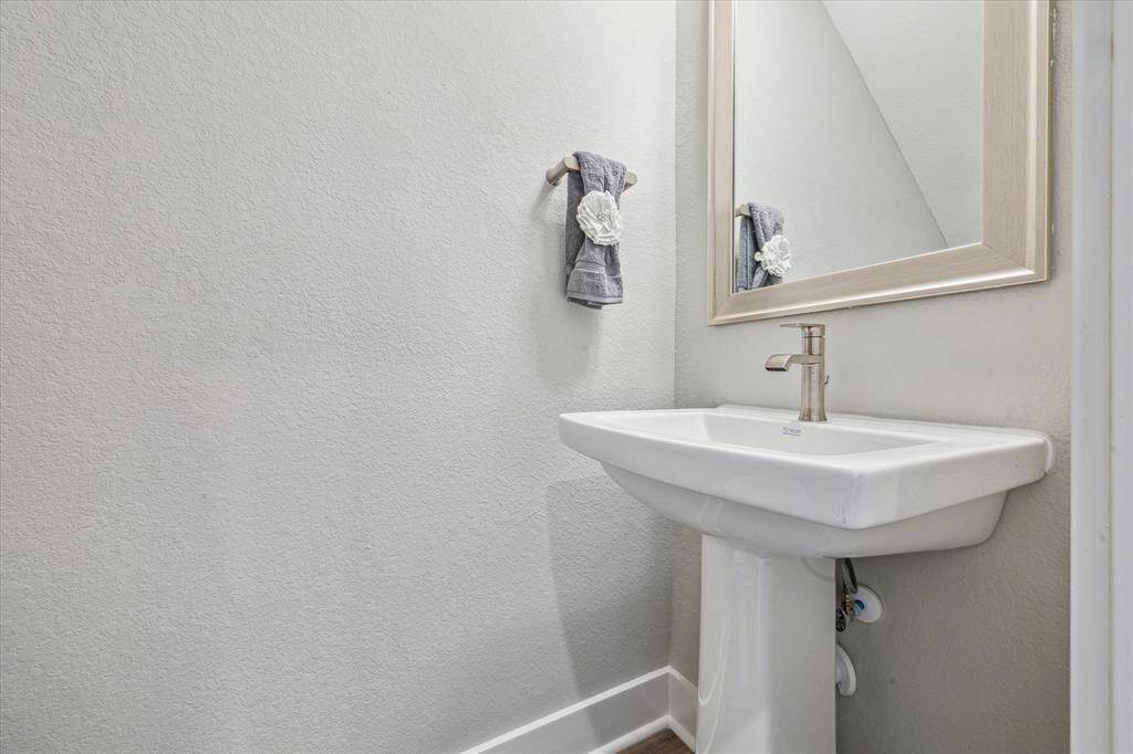 Guest powder bathroom is easily accessible on the first floor