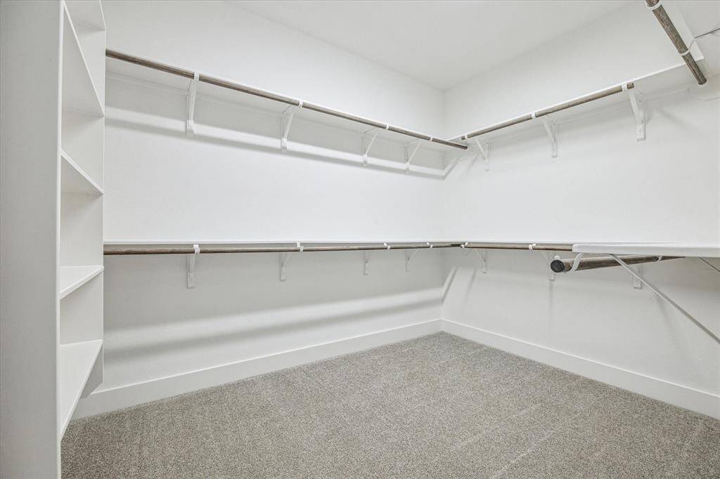 This huge closet (11 x 9) includes room for a third row of additional shelving or hanging