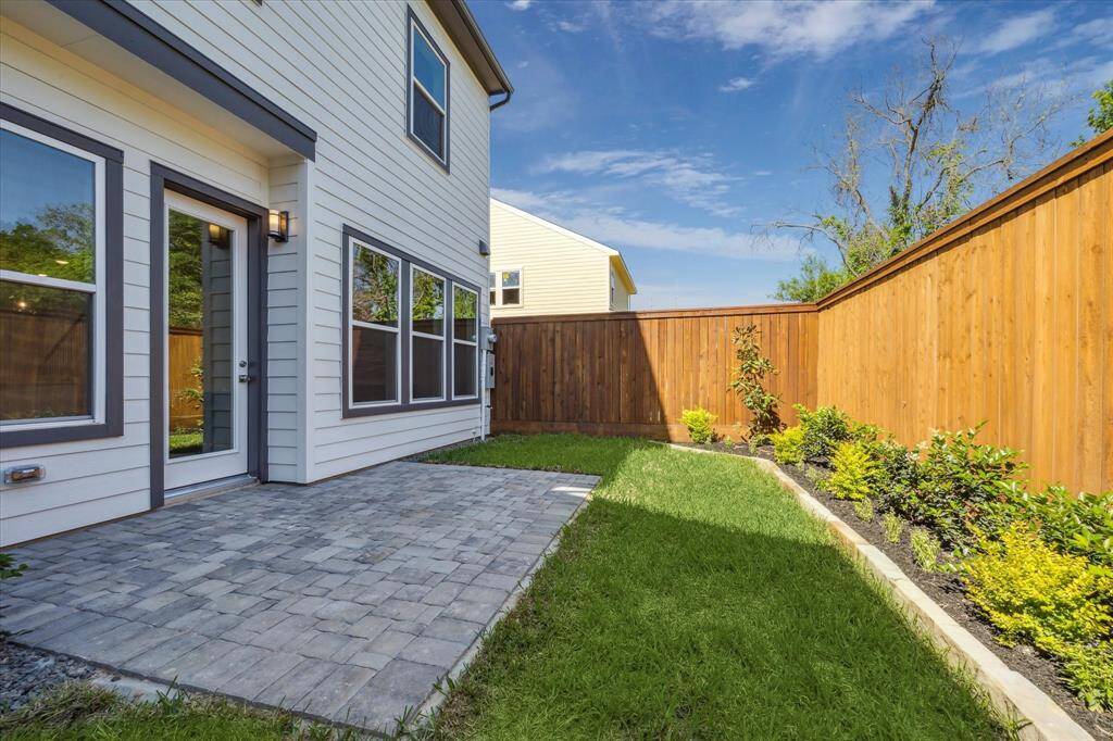 Private backyard with gardening beds and pavered patio. HOA includes water, sewer, valet trash pickup (2X a week) and front and backyard maintenance.