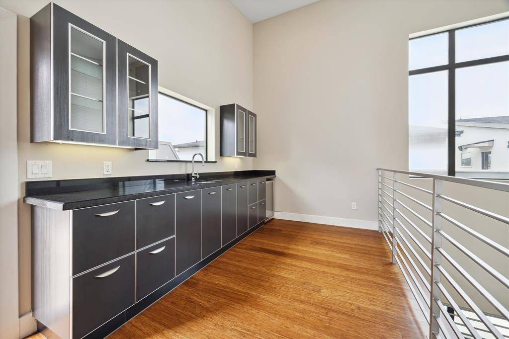 Fourth-floor wet bar, just steps from the rooftop deck, perfect for effortless entertaining and enjoying the views.