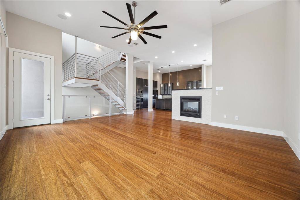 View from the family room to the dining area, showcasing the home's bright, airy layout with abundant natural light flowing throughout.