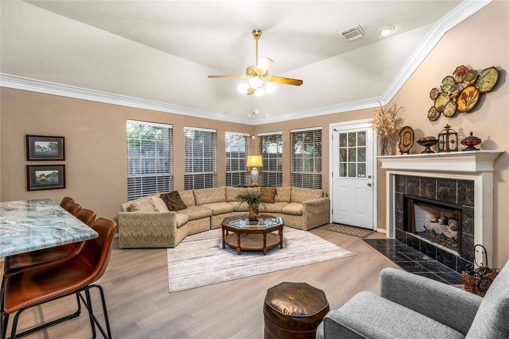 Another view of the living room showing the gaslog fireplace.