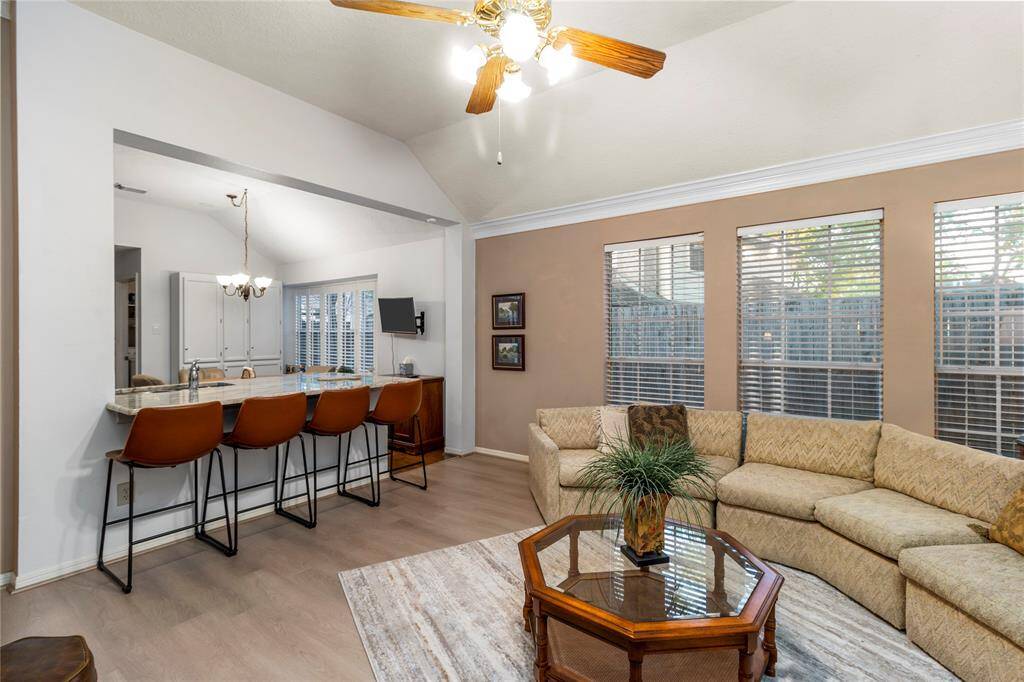 Yet another view of the living room showing how it opens from the kitchen and dining area.