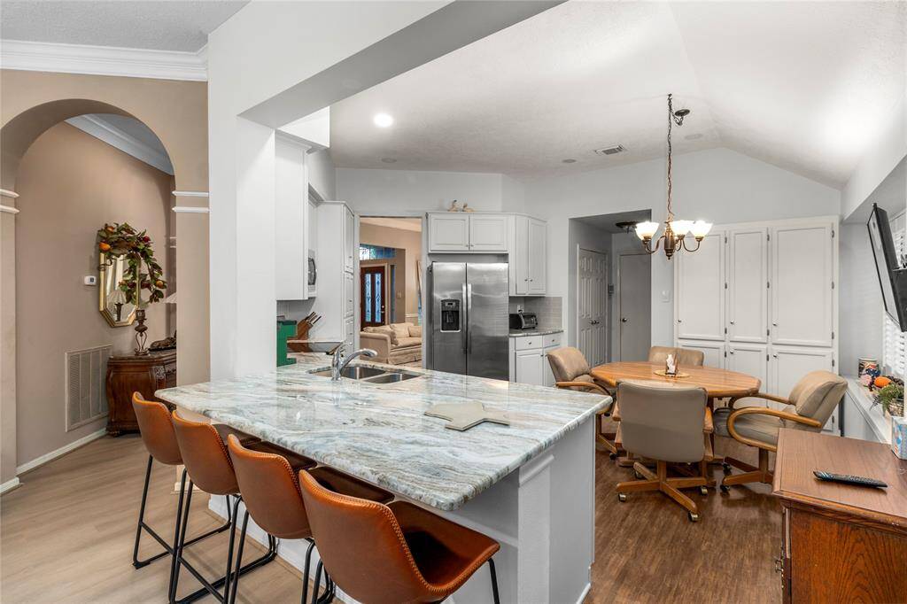Another view from living room showing the breakfast bar and looking into the kitchen.