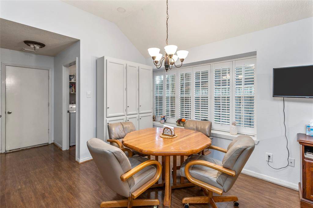 The dining area in the kitchen features a table with an extra piece that allows the table to expand for more room and guests.