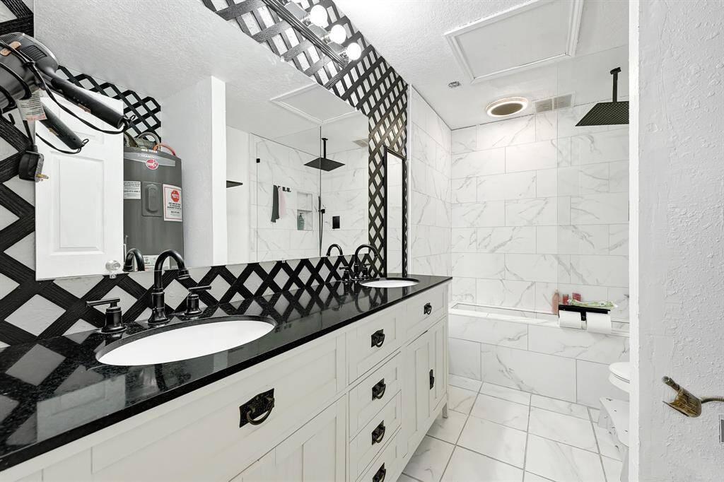 Guest Quarters:Also features a fully renovated bathroom complete with double sinks, a walk-in shower, and upgraded fixtures. Combined with the full-size kitchen, private entrance, and in-unit laundry connections, this space offers both comfort and functionality—ideal for guests, extended family, or rental income.