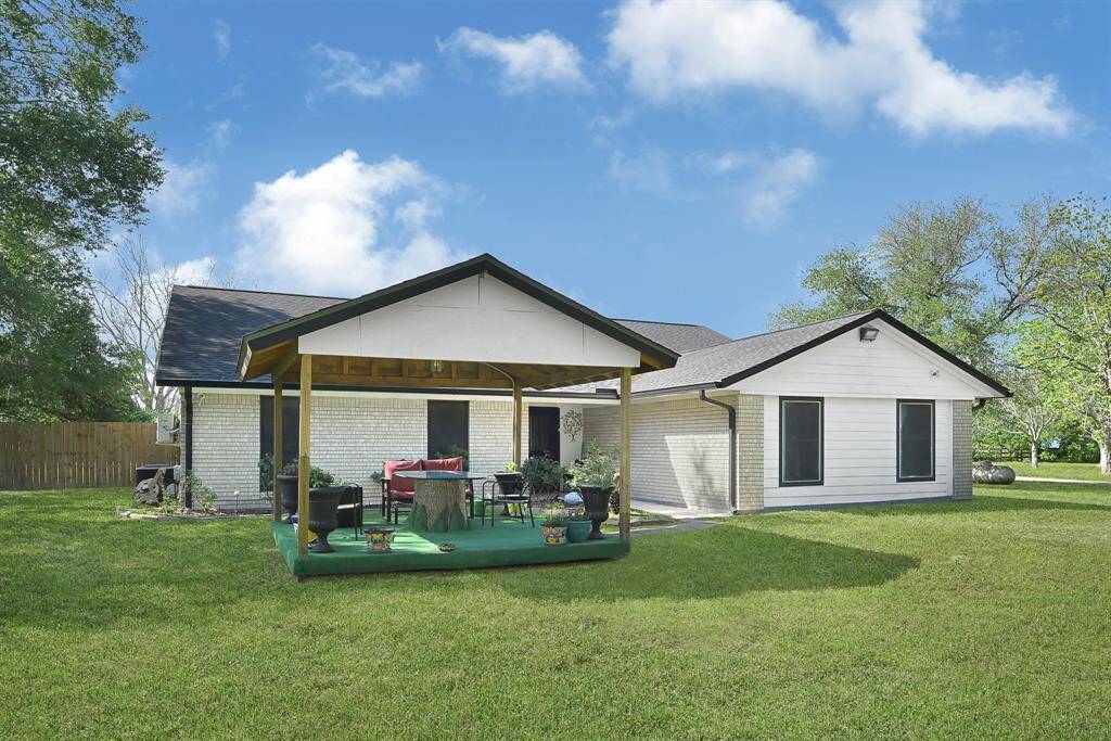 Welcome guests to your own outdoor retreat with a spacious front yard and charming palapa-style porch—perfect for relaxing evenings, entertaining, or weekend gatherings under the shade.