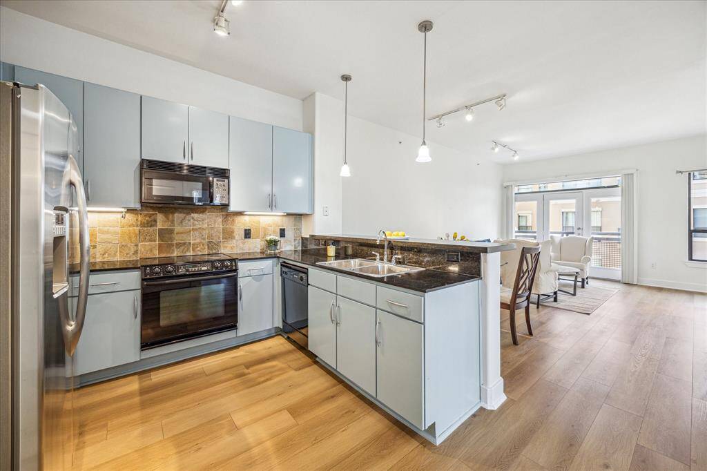 The kitchen features vibrant, Tiffany & Co.-inspired hues that add a touch of elegance and charm.