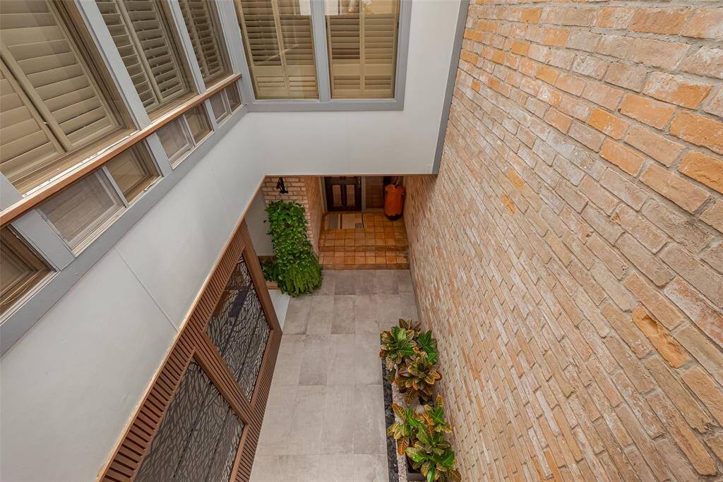 A view from the upstairs balcony. The windows belong to the game room/3rd bedroom.