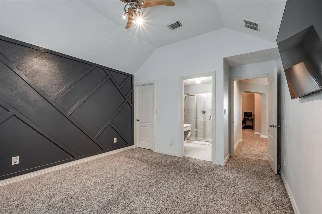 Explore the comfort of this secondary bedroom located upstairs featuring an en-suite bathroom for privacy and convenience.