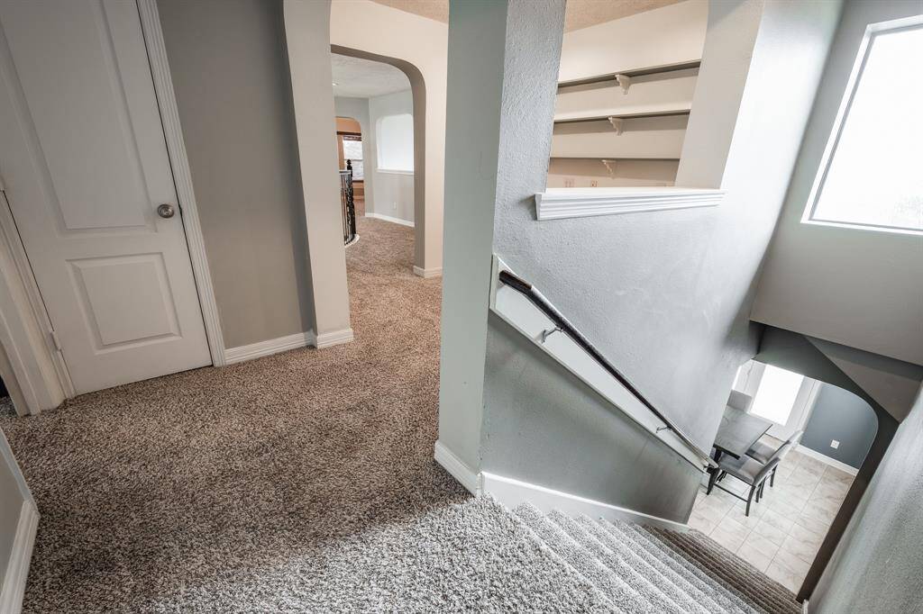 Convenient secondary staircase leads downstairs  into the breakfast nook.