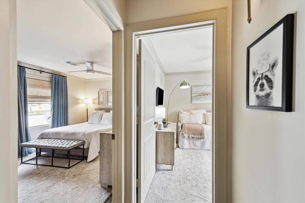 Hallway leading to the bedrooms provides a seamless flow into each space, tucked away from the family room providing a quiet retreat.