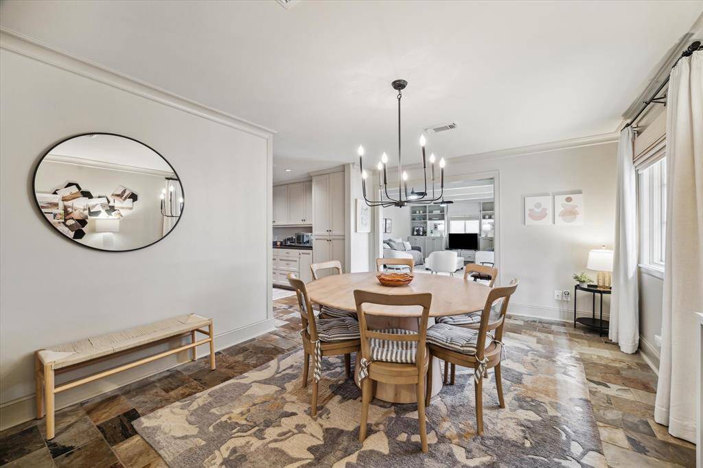 This view of the dining room allows you to see the connectivity to the kitchen as well as the living room.