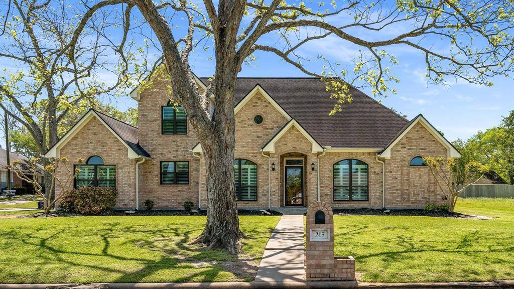 This charming brick home features a classic design with a steep gabled roof and arched windows. It sits on a spacious, well-maintained lawn with mature trees and a welcoming front entrance. Ideal for buyers seeking a blend of elegance and comfort. Pride of ownership shows in this well kept beauty!