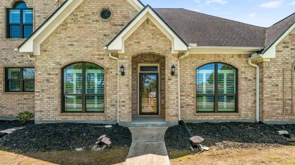 Discover elegance in this exquisite custom-built home! Great curb appeal!