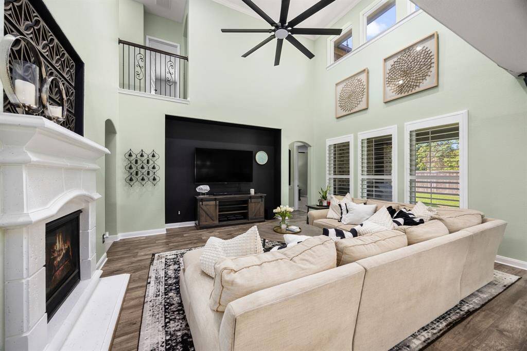 Den/Family room with crown molding, recessed lighting and gas fireplace. Open to gorgeous chef's kitchen. Perfect for entertaining!