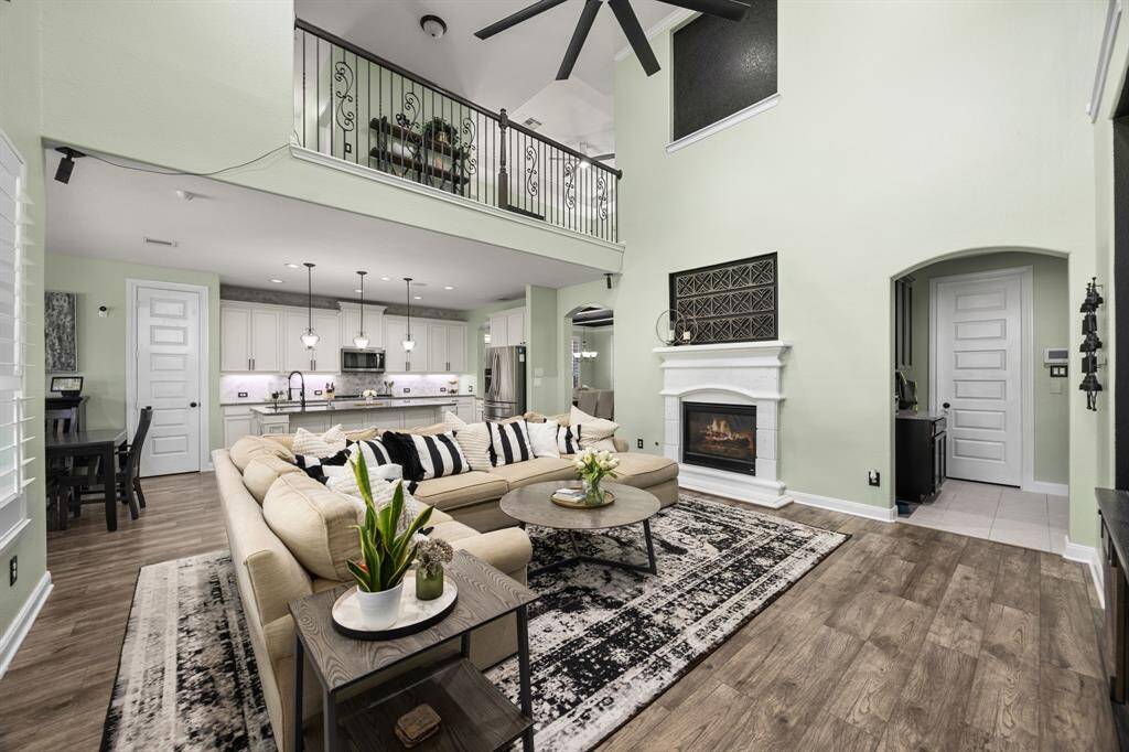Den/Family room with souring celings, lots of natural light.  Open to gorgeous chef's kitchen. Perfect for entertaining!