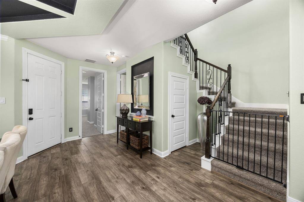 The inviting entryway transitions beautifully into the heart of this home.