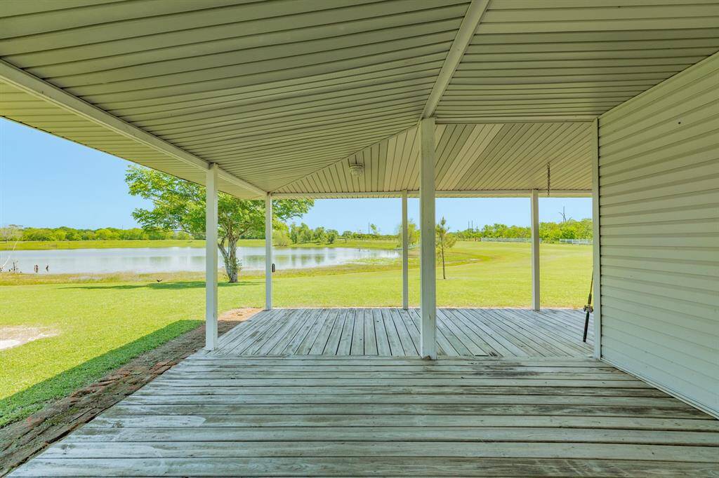 This wrap-around porch is a nice place to relax or if you are in the mood to entertain, you could set up tables for friends & family.