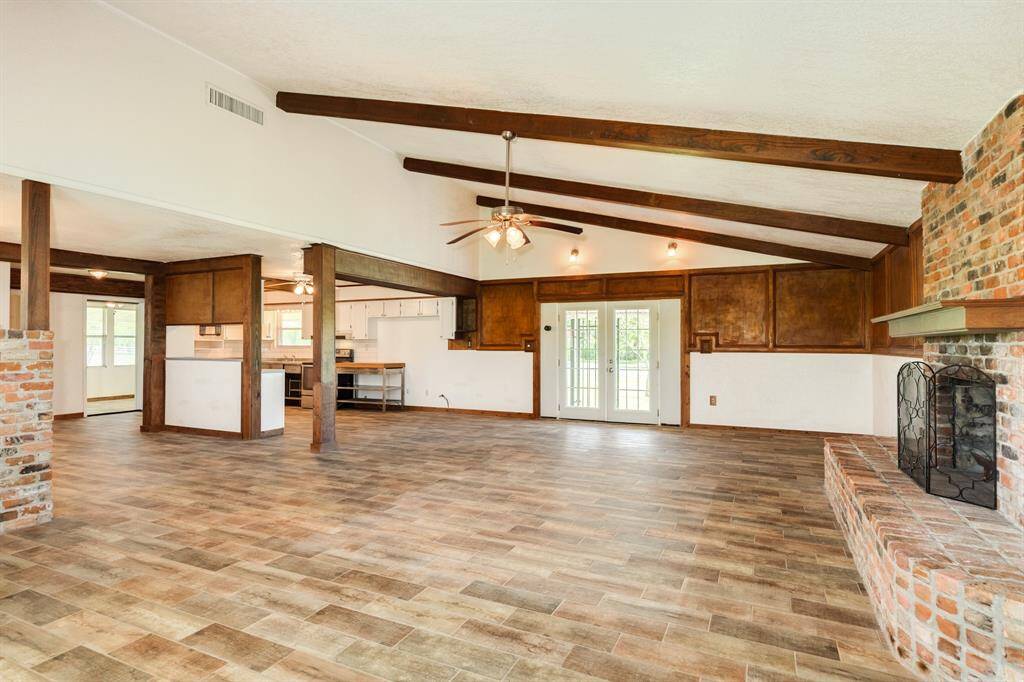 View of Living Area toward Kitchen. Huge Living Area is approximately 29'3" x 20'1". Buyer to verify all room measurements.