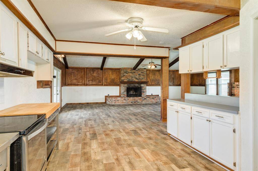 View of Kitchen toward Living Area. Kitchen is approximately 19'5" x 12'5". Buyer to verify all room measurements.