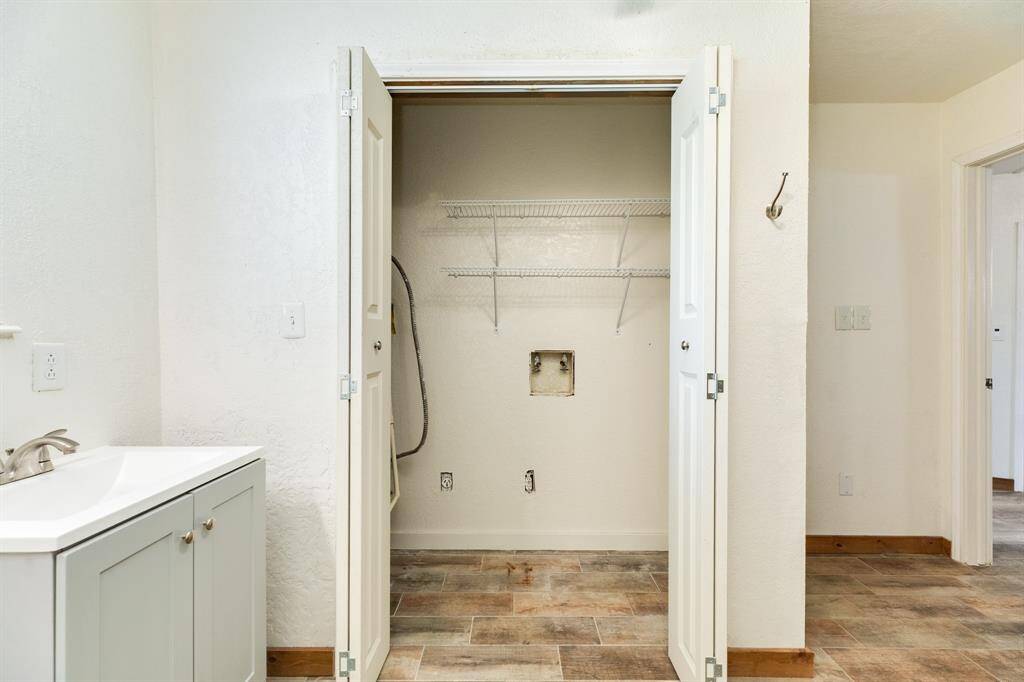 Utility Area is inside the bi-fold doors in the First Floor Full Bathroom.