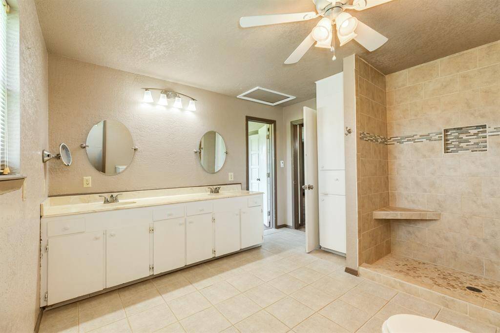 Bathroom Upstairs features Double Sinks and a fantastic walk-in shower.
