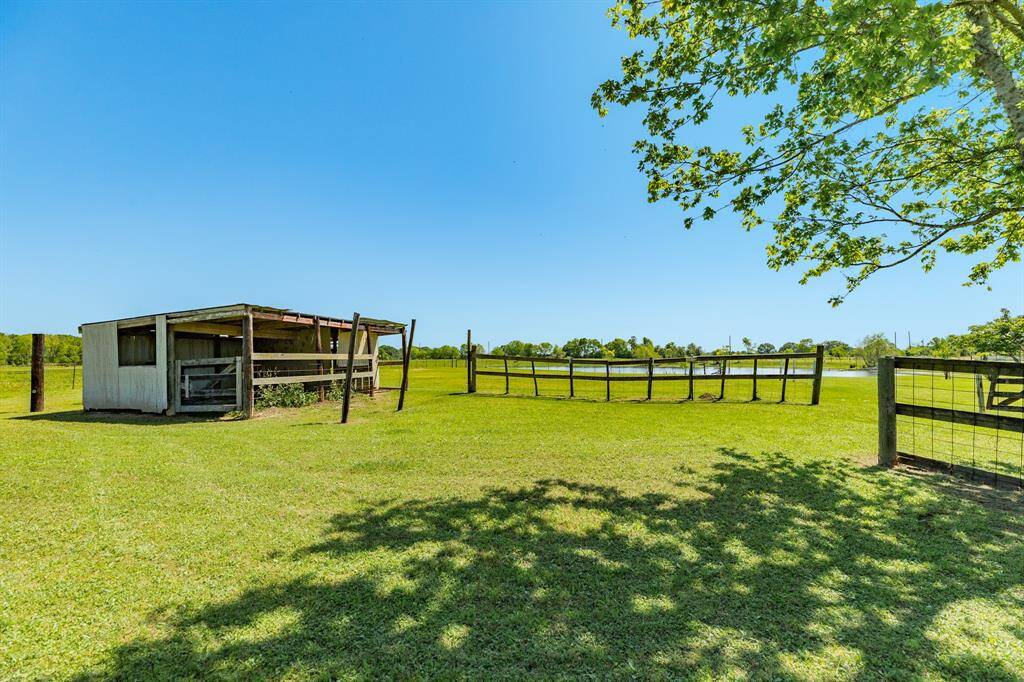 View of the Livestock Shed & Pen. This could also be converted into a Chicken Coop. Shed & Pen has not been used by current Owner, but it just needs some work & TLC.