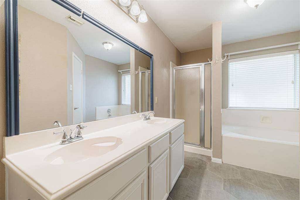 ensuite bath with dual sinks, a garden tub and a separate shower.