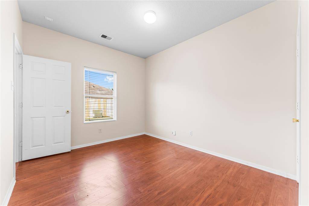 Guest bedroom on first floor can also be used for a private study.