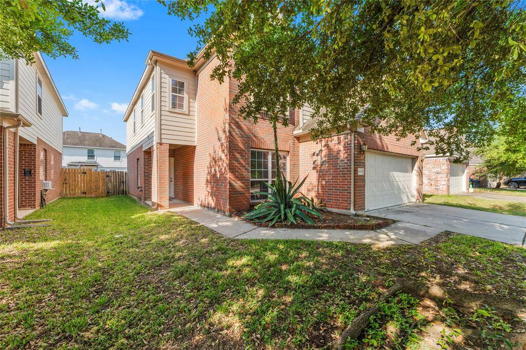 The entrance is inviting with a walkway leading to the front door.