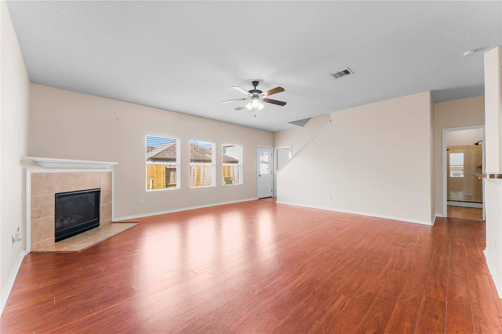 Neutral walls and ample natural light create a welcoming atmosphere.