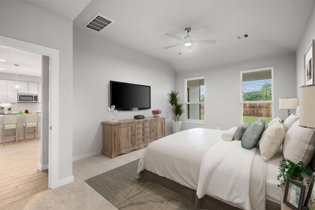 Escape the day's chaos and find serenity in the grand primary suite! Enjoy the comfort of plush carpeting, soothing paint hues, high ceilings, and large windows fitted with privacy blinds. Virtually staged. Sample photo, actual color and selections can vary.