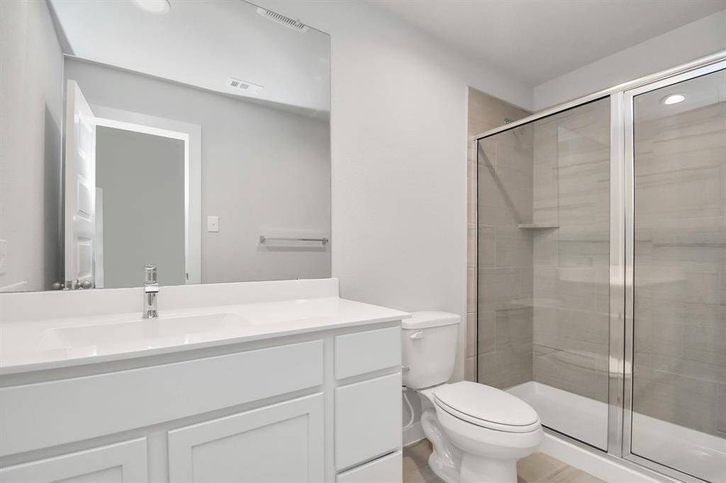 Guest suite bath with walk in shower. Sample photo, actual color and selections can vary.