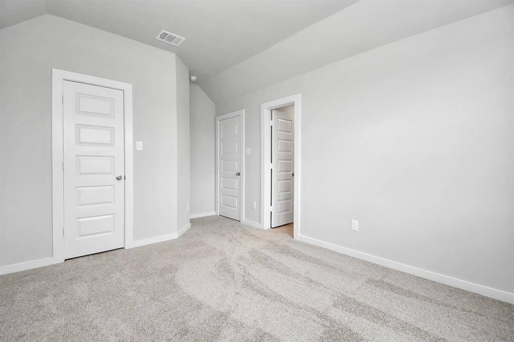 Generously sized secondary bedrooms, complete with spacious closets and soft, inviting carpeting. Sample photo, actual color and selections can vary.