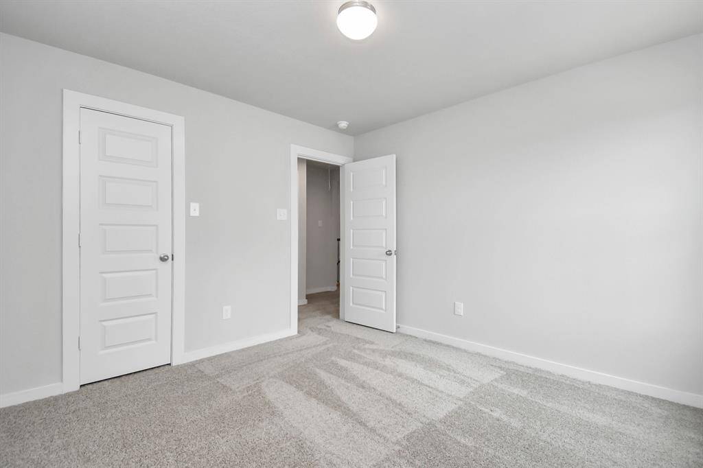 Generously sized secondary bedrooms, complete with spacious closets and soft, inviting carpeting.